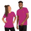 Two people wearing matching purple T-shirts smiling.