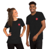 Two people wearing matching black t-shirts with red logos.
