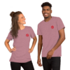 A smiling young woman and man wearing matching mauve t-shirts with a small red logo.