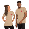 A man and woman smiling wearing matching beige t-shirts with a red logo.